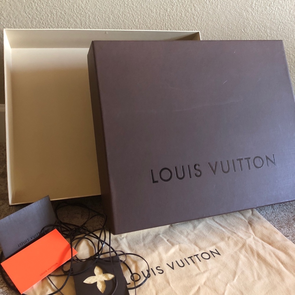 Louis Vuitton large brown box for a purse or bag.